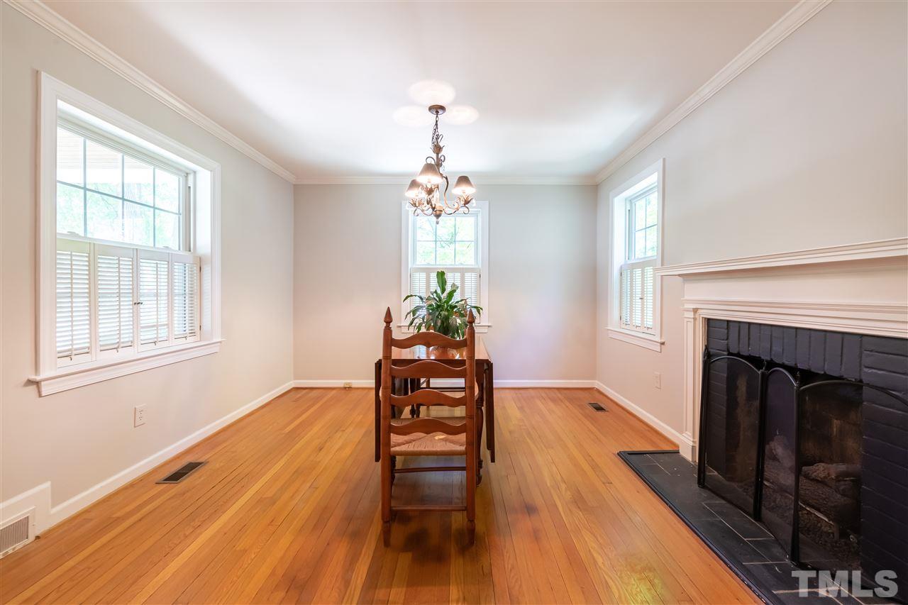 914 Canterbury Road Raleigh, NC 27607 - Photo 4 of 29 a living room with furniture and a fireplace