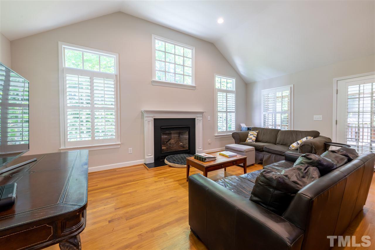 914 Canterbury Road Raleigh, NC 27607 - Photo 10 of 29 a living room with furniture and a fireplace