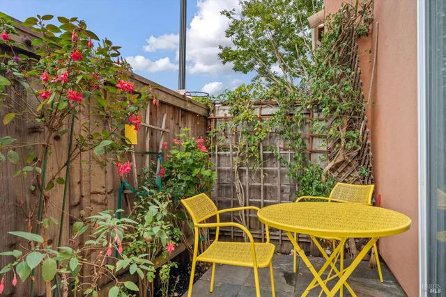 a view of a tables and chair and table in the patio
