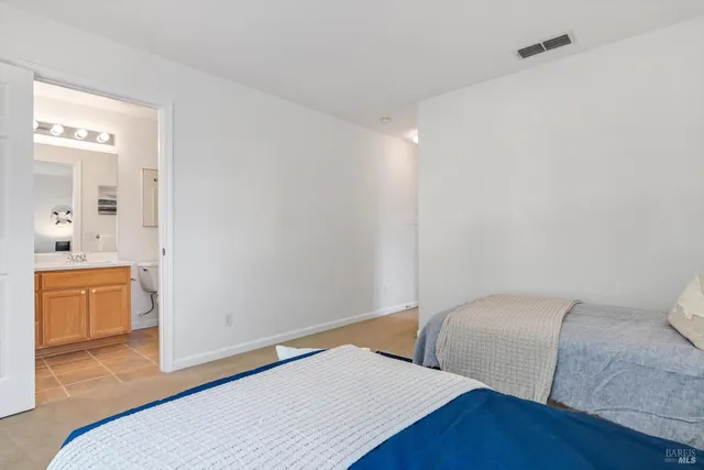 a bedroom with a bed and a couch