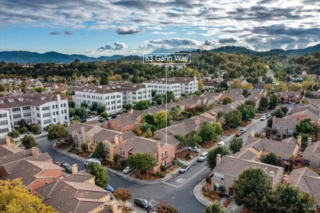 an aerial view of residential houses with outdoor space