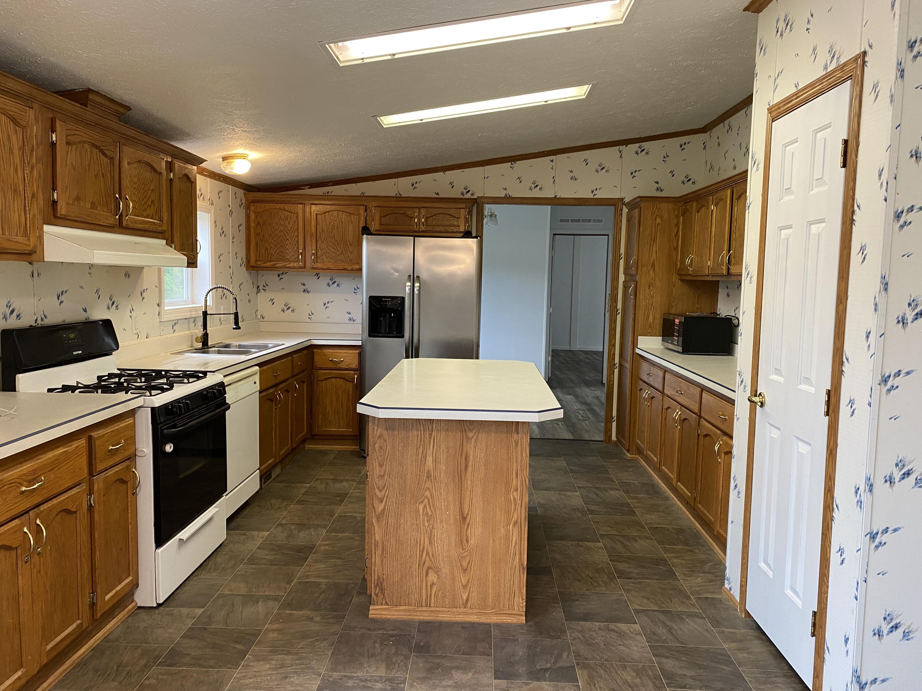 735 South Bossett Road Ravenna, MI 49451 - Photo 8 of 23 kitchenisland