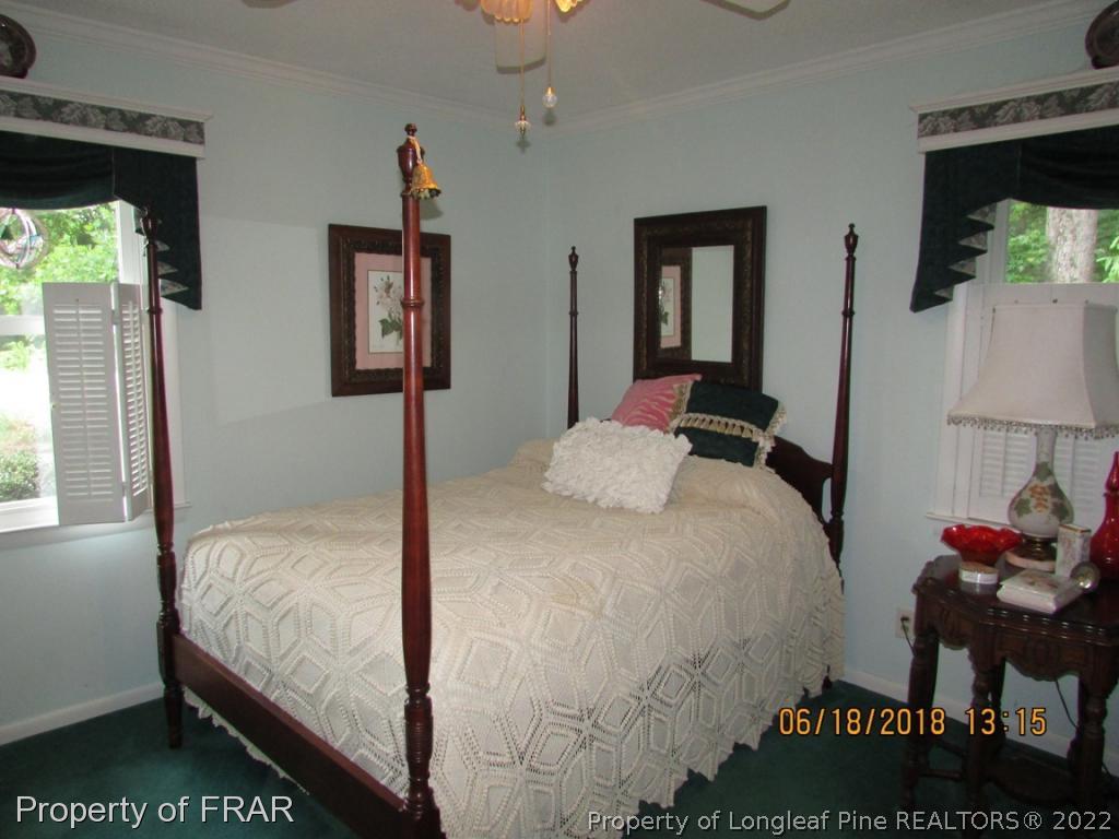 20 Page Road Godwin, NC 28344 - Photo 18 of 20 a bedroom with a bed and a window