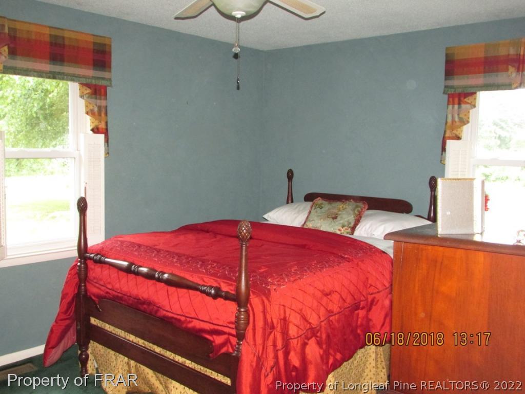 20 Page Road Godwin, NC 28344 - Photo 19 of 20 a bedroom with a bed and a window