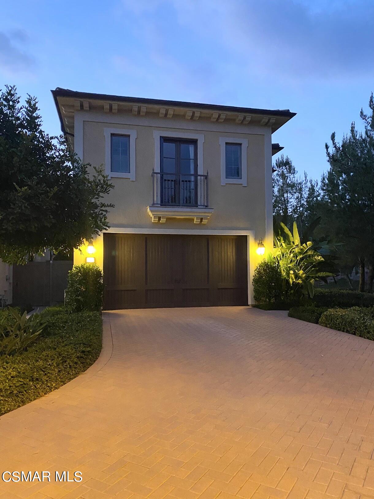 a front view of a house with yard