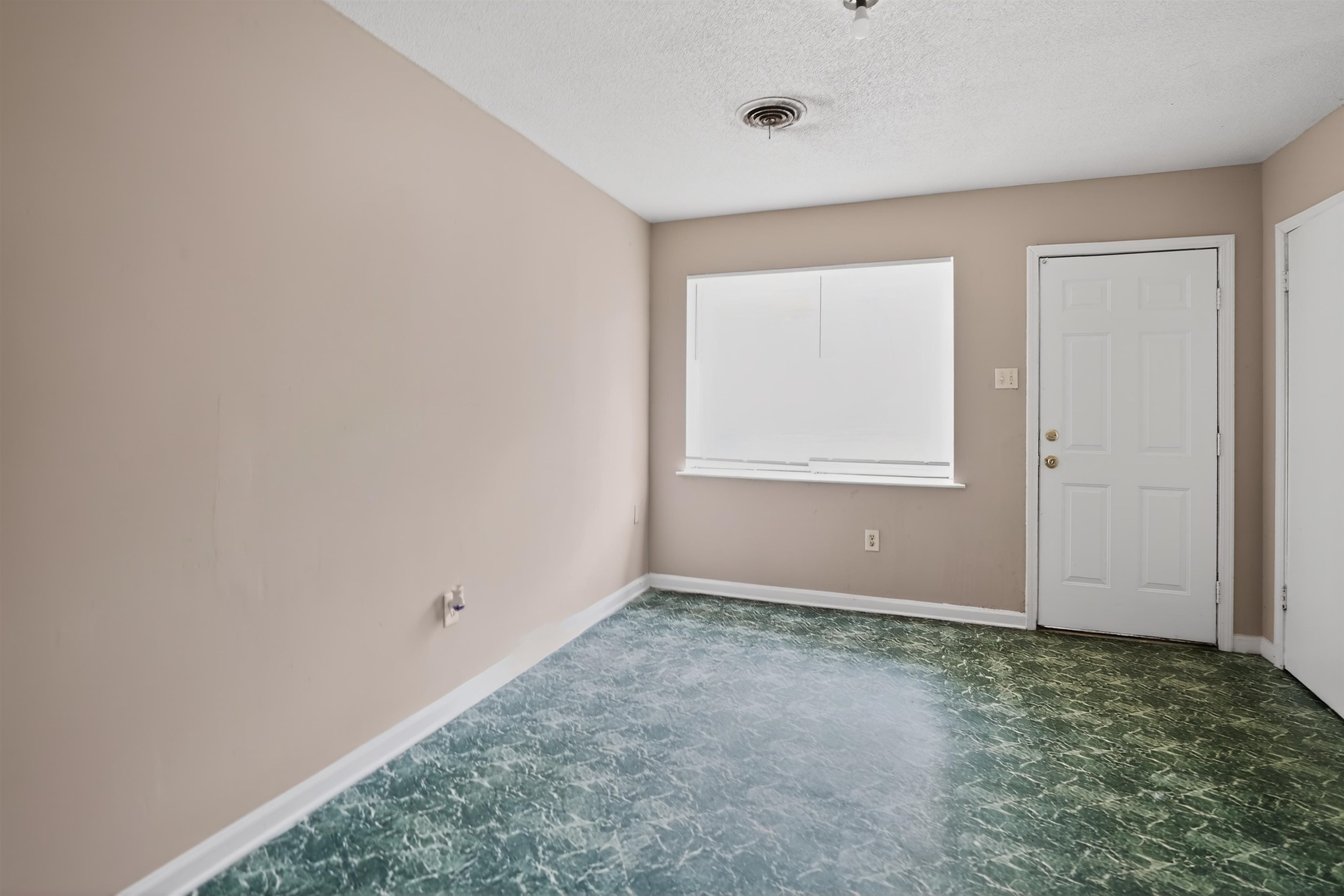 4530 Spring Valley Drive Memphis, TN 38128 - Photo 5 of 15 Interior room featuring neutral wall paint and patterned flooring
