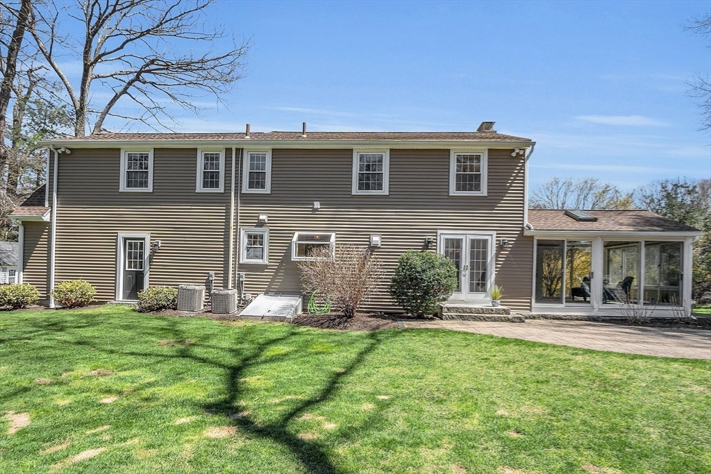 4 Thoreau Road Acton, MA 01720 - Photo 2 of 35 a front view of a house with a yard