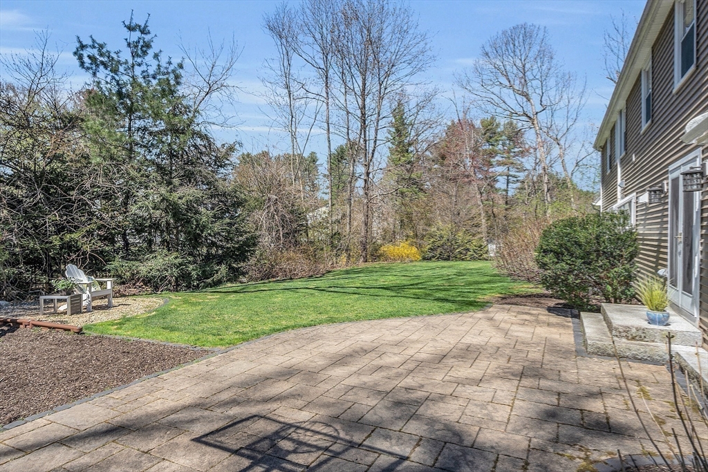 4 Thoreau Road Acton, MA 01720 - Photo 3 of 35 a pathway with a yard