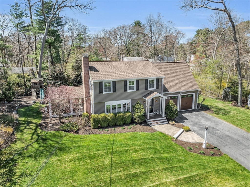 4 Thoreau Road Acton, MA 01720 - Photo 33 of 35 a front view of house with yard and green space