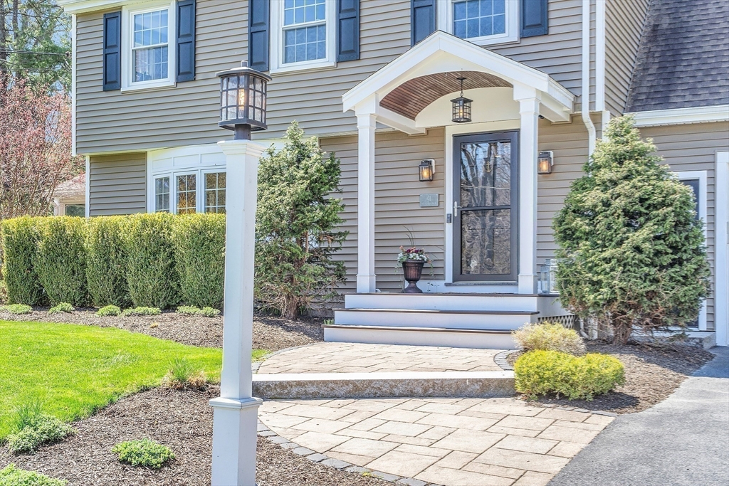4 Thoreau Road Acton, MA 01720 - Photo 5 of 35 a front view of a house with garden
