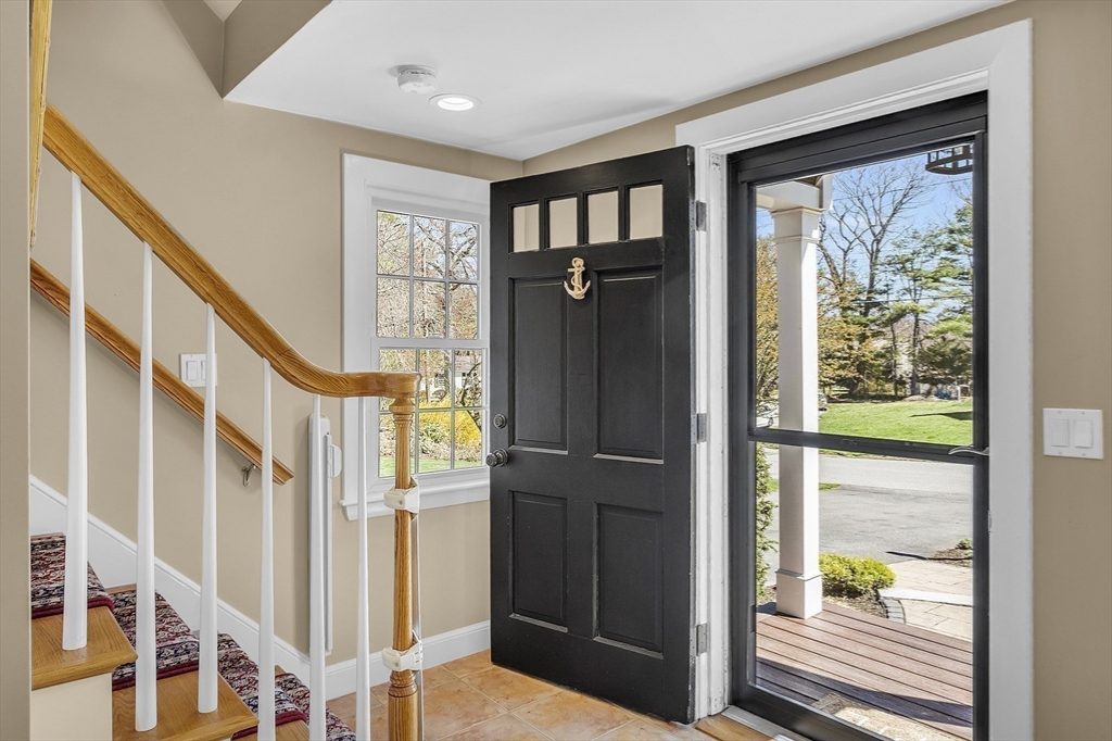 4 Thoreau Road Acton, MA 01720 - Photo 6 of 35 a view of an entryway with wooden floor windows and a livingroom