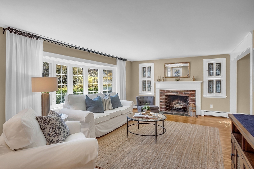 4 Thoreau Road Acton, MA 01720 - Photo 9 of 35 a living room with furniture and a fireplace