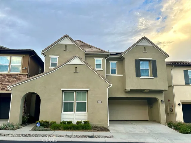 a front view of a house with a garage