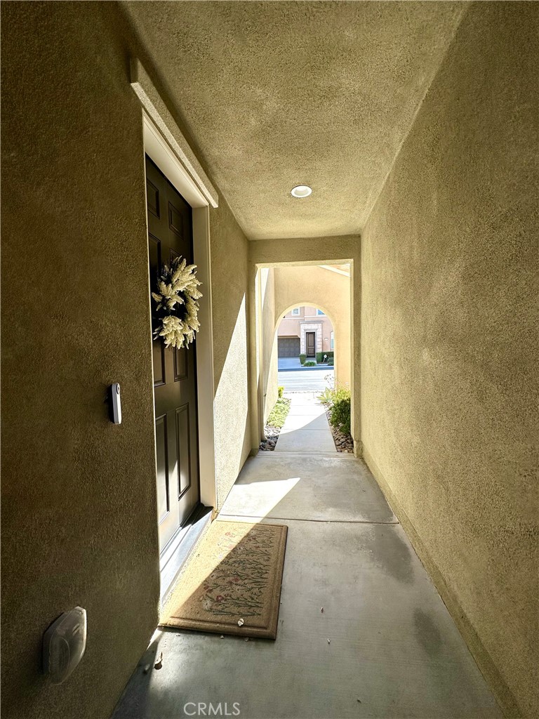 2036 Legacy Chino Hills, CA 91709 - Photo 2 of 20 a view of a hallway to a livingroom with furniture