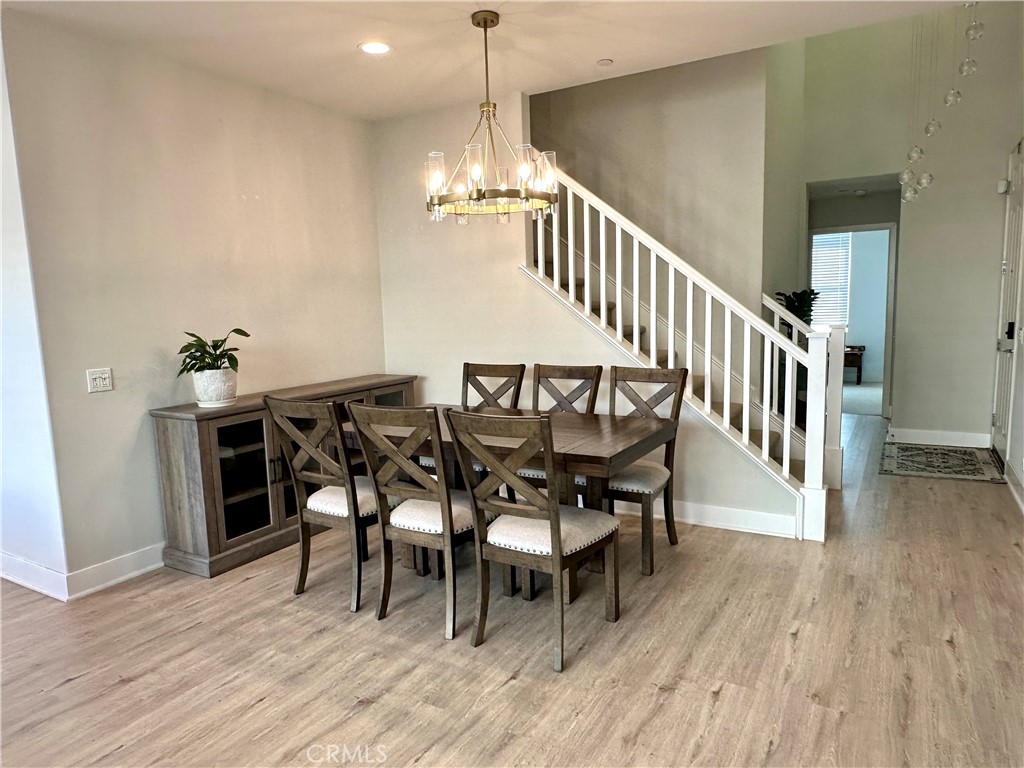 2036 Legacy Chino Hills, CA 91709 - Photo 10 of 20 a view of a dining room and livingroom with furniture wooden floor a chandelier