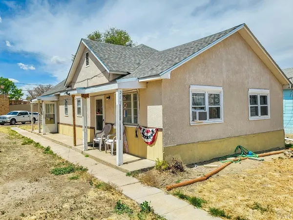 a front view of a house with a patio