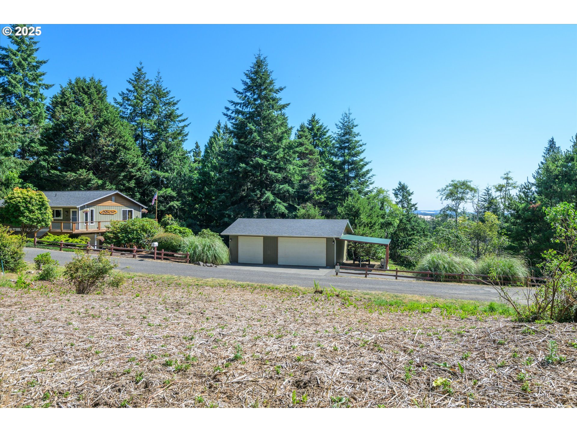 View Loop, Unit 3 Florence, OR 97439 - Photo 11 of 15 a view of a house with a swimming pool
