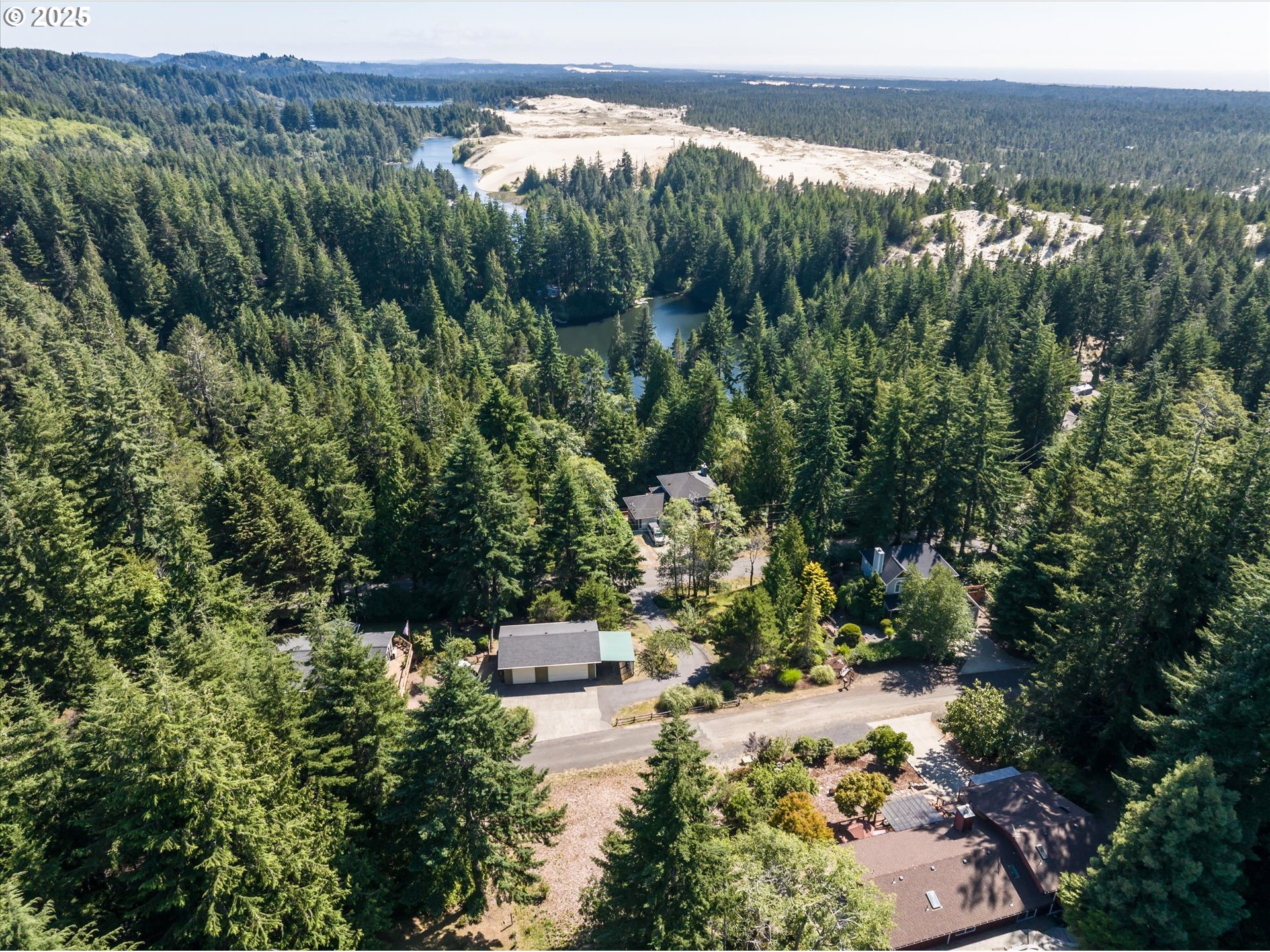 View Loop, Unit 3 Florence, OR 97439 - Photo 12 of 15 a view of a city with lush green forest
