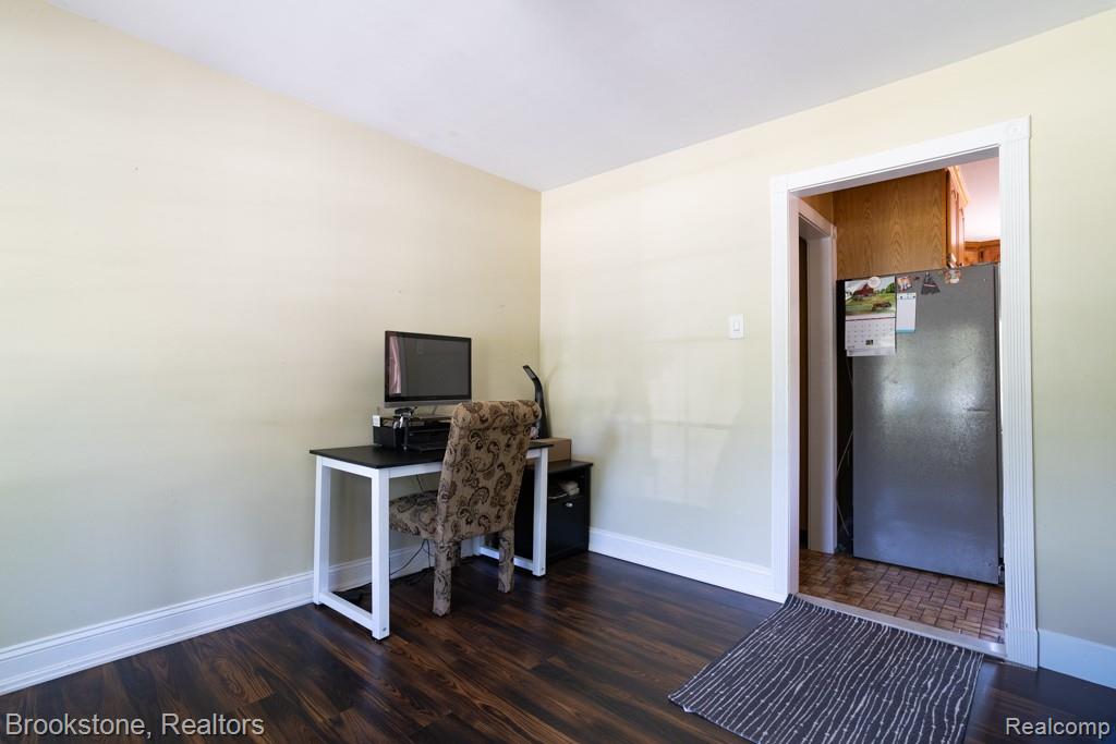 30100 Armada Ridge Road Richmond, MI 48062 - Photo 10 of 29 Interior room featuring light-toned walls, dark wood-finish flooring, and white baseboards