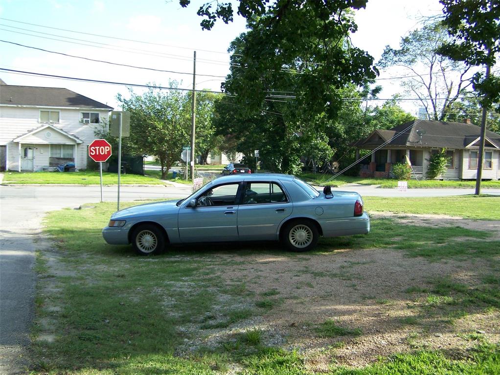 a view of a car parked in the yard