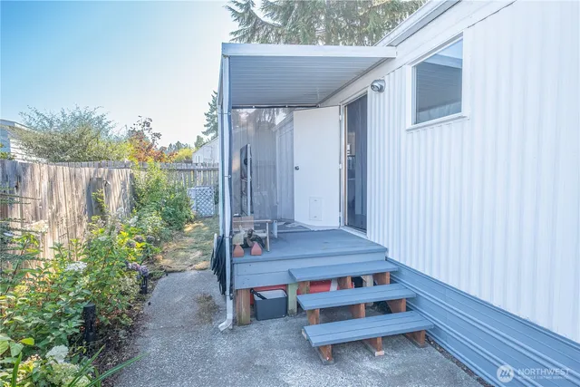 a backyard of a house with outdoor seating