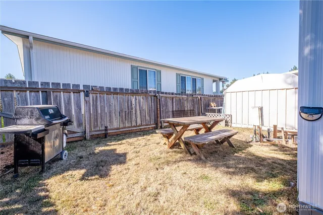 a living room with furniture window and a table