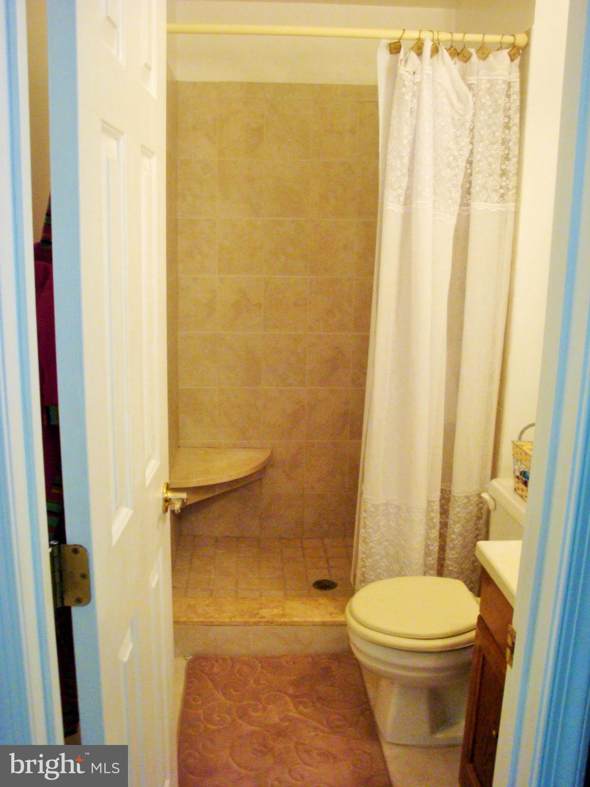 10159 Marshall Pond Road Burke, VA 22015 - Photo 15 of 28 a bathroom with a toilet and shower