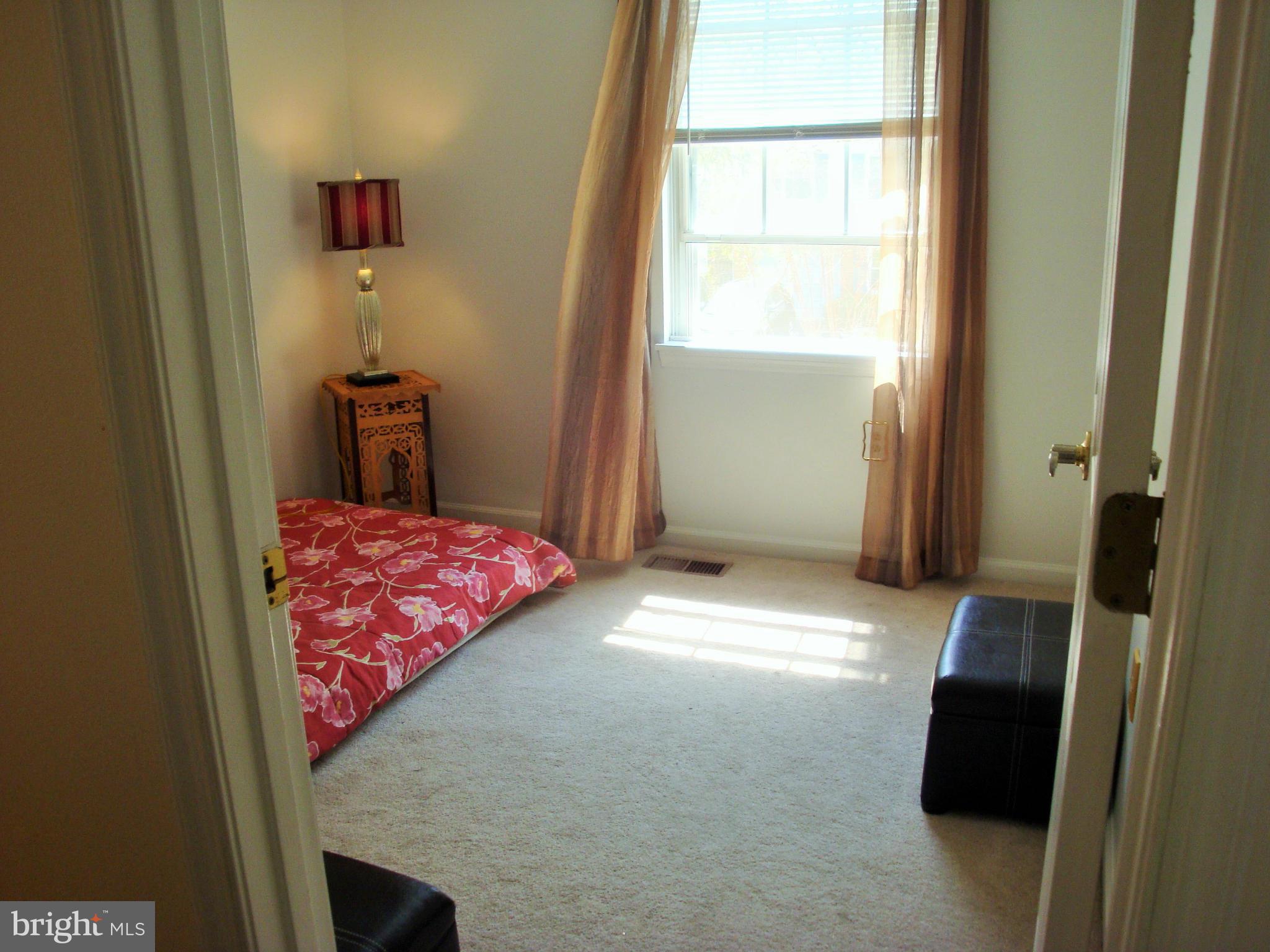 10159 Marshall Pond Road Burke, VA 22015 - Photo 17 of 28 a bedroom with a bed and a window