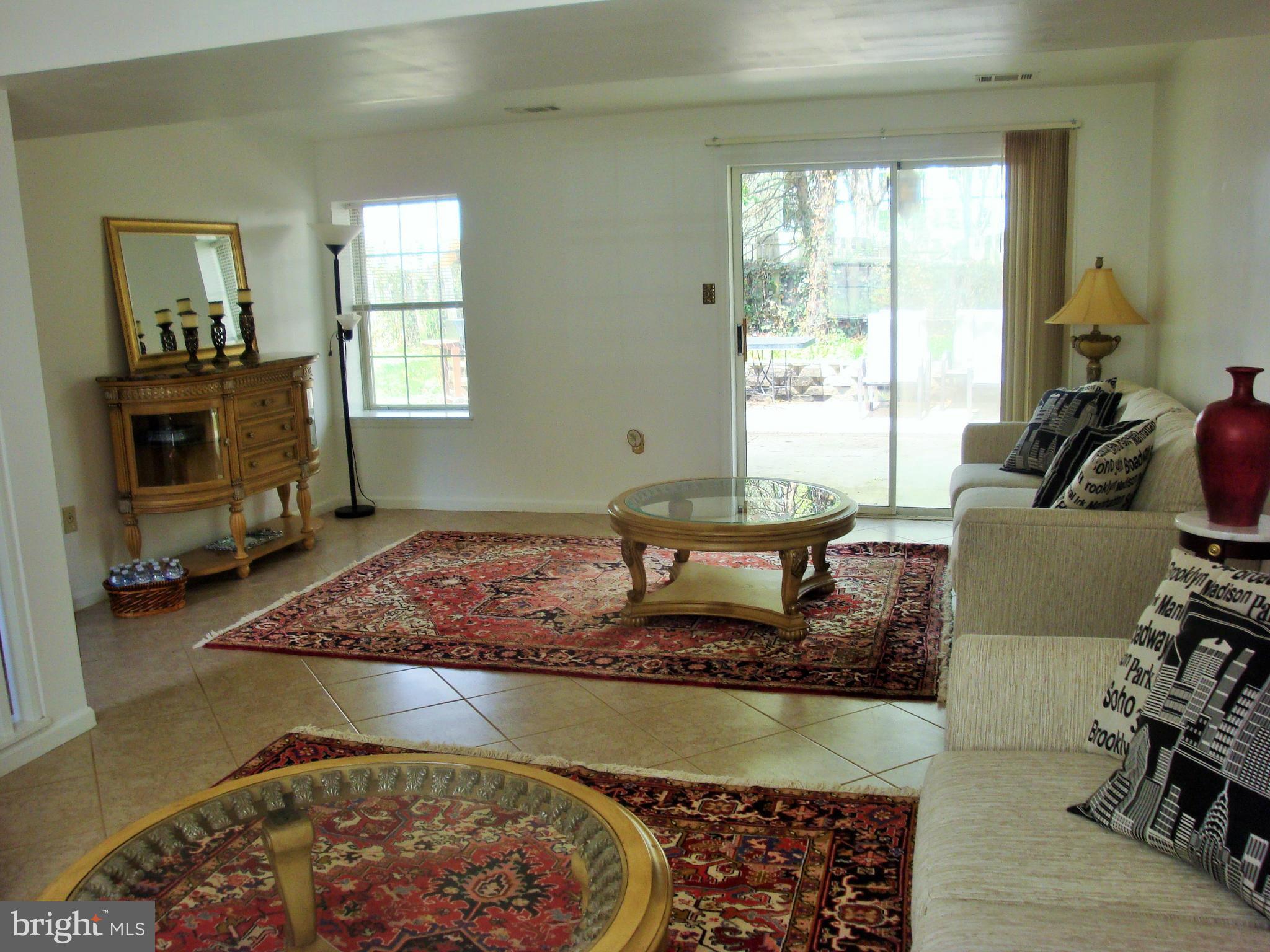 10159 Marshall Pond Road Burke, VA 22015 - Photo 21 of 28 a living room with furniture and a flat screen tv