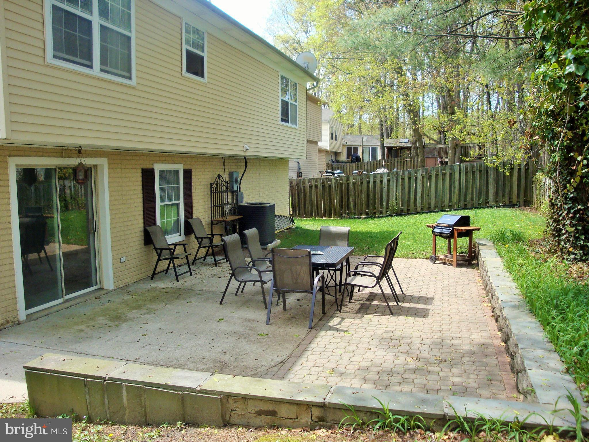 10159 Marshall Pond Road Burke, VA 22015 - Photo 26 of 28 a view of a house with backyard and sitting area