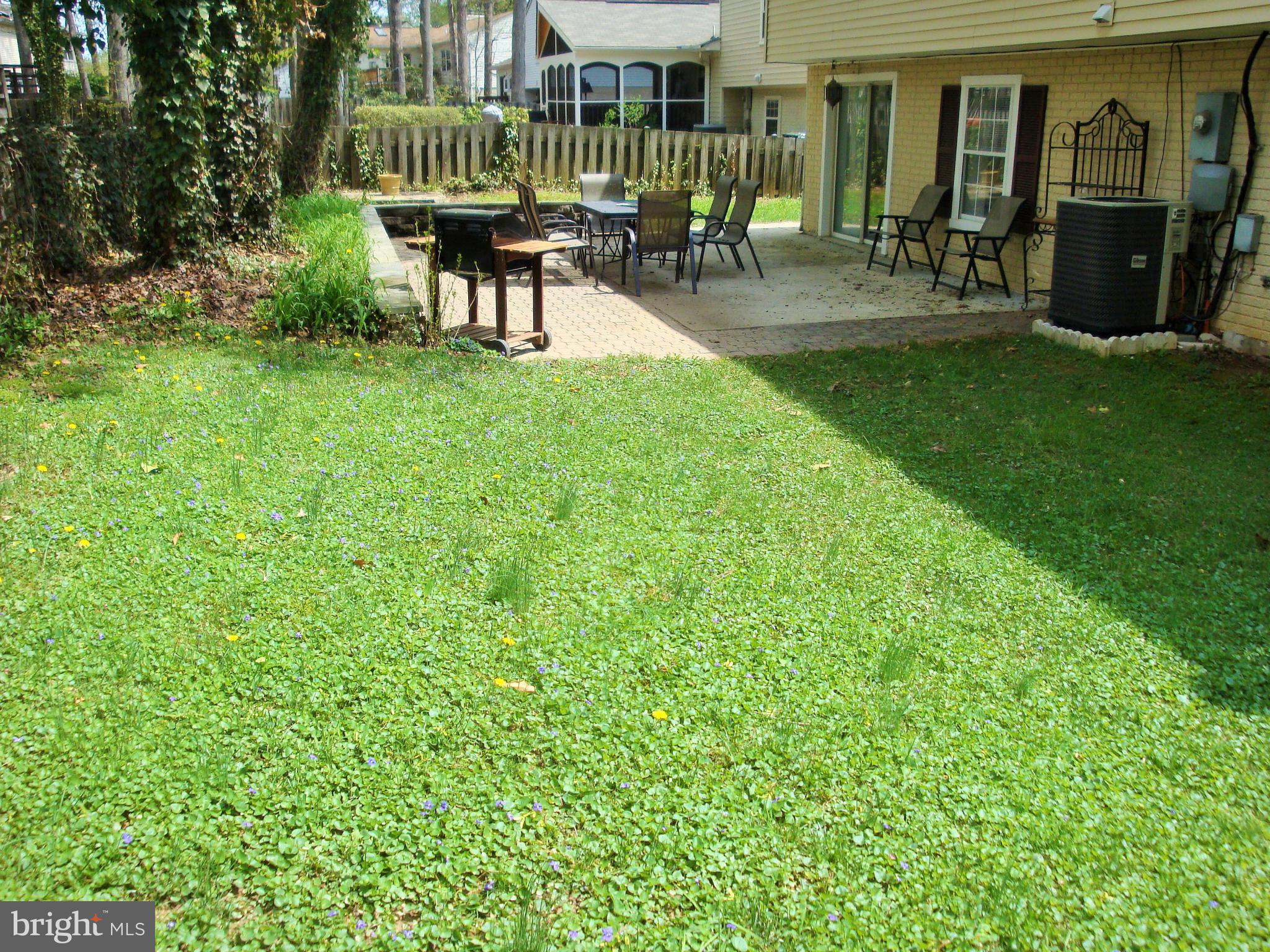10159 Marshall Pond Road Burke, VA 22015 - Photo 27 of 28 a view of a house with backyard and sitting area