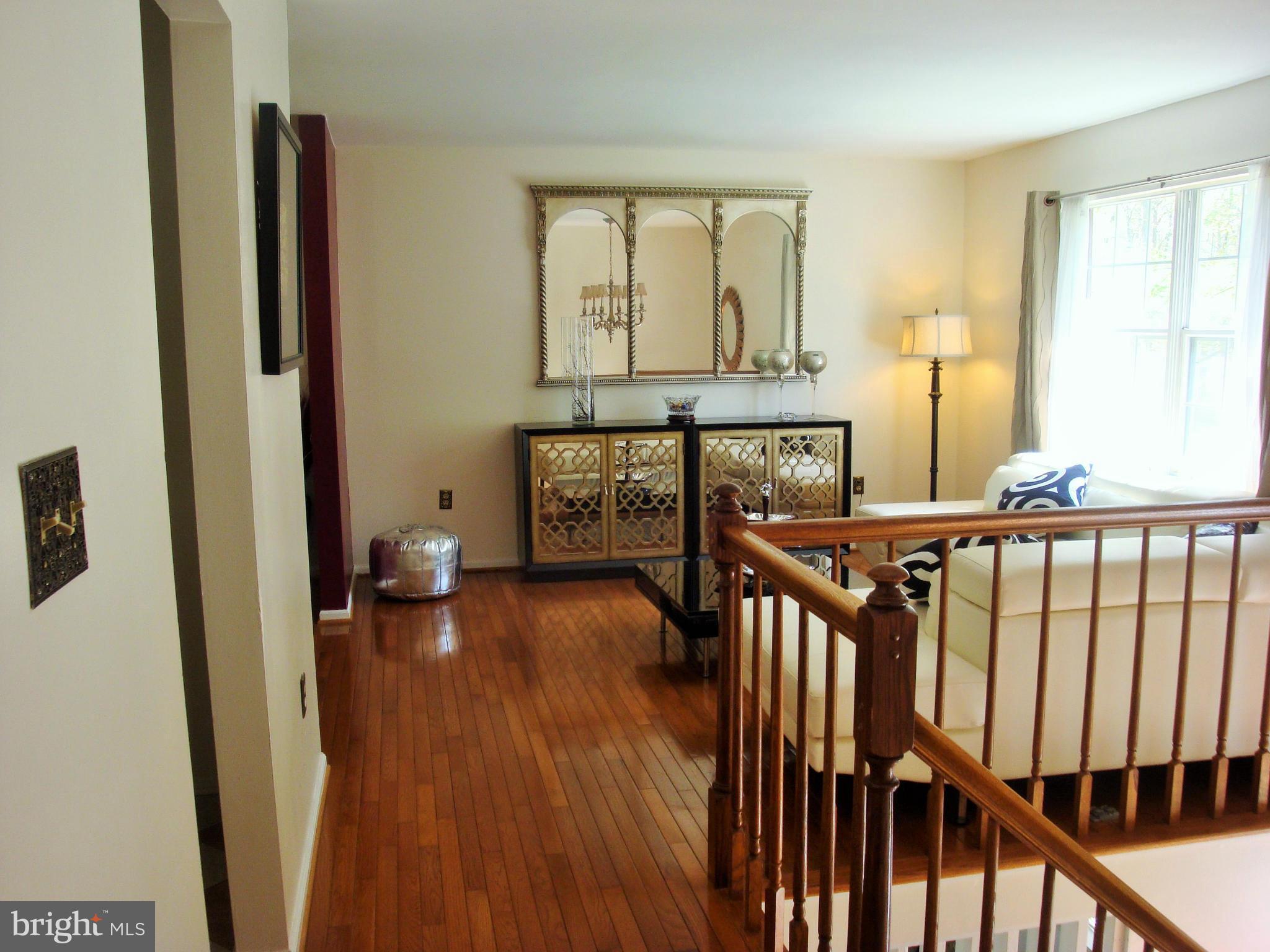 10159 Marshall Pond Road Burke, VA 22015 - Photo 5 of 28 a view of a porch with wooden floor and windows