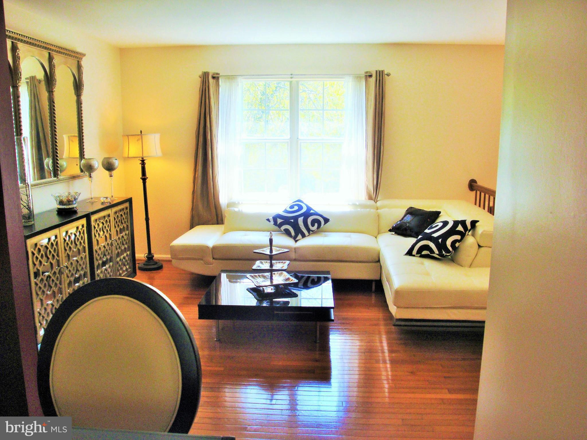 10159 Marshall Pond Road Burke, VA 22015 - Photo 7 of 28 a living room with furniture and a large window