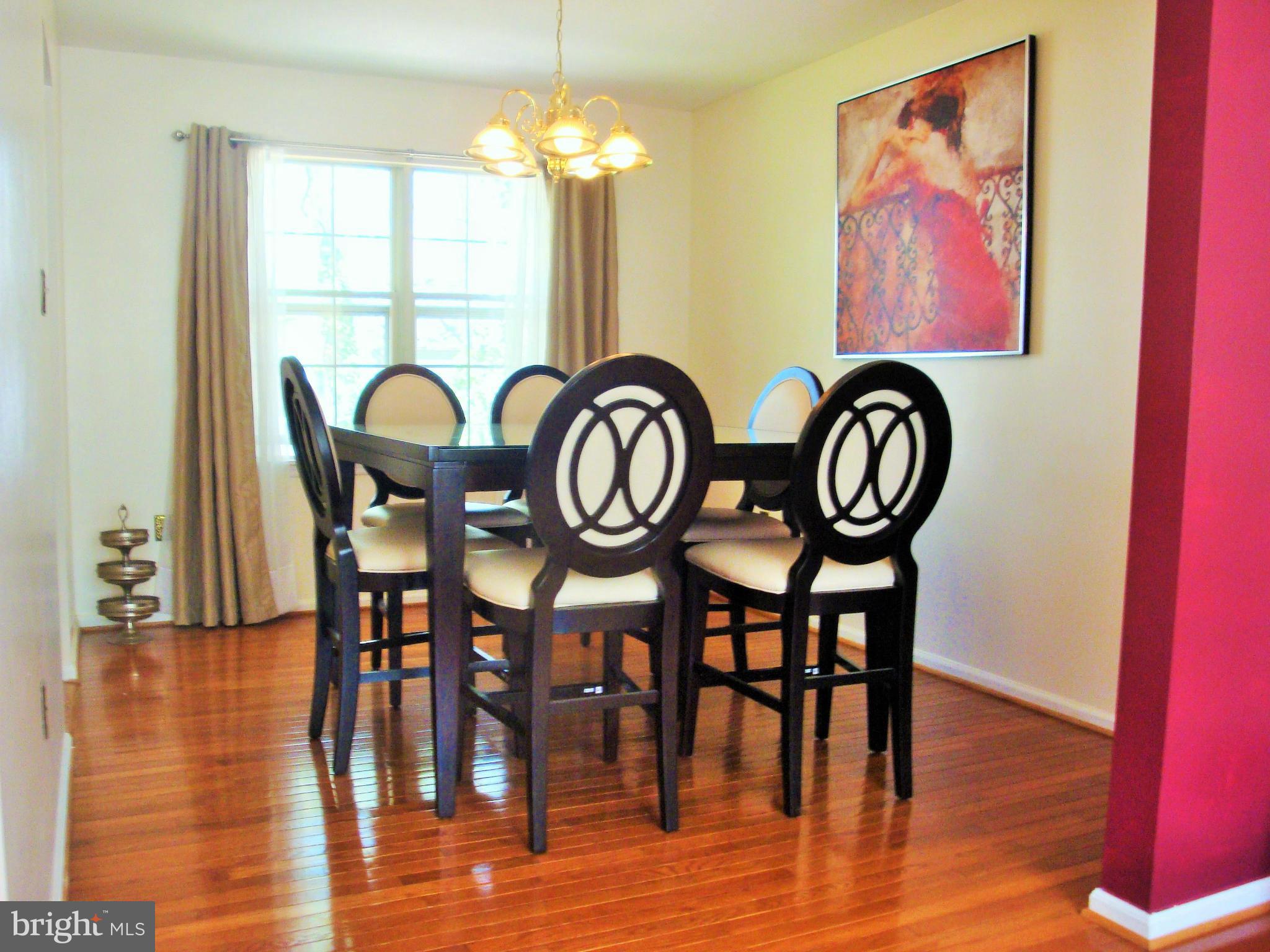 10159 Marshall Pond Road Burke, VA 22015 - Photo 9 of 28 a view of a dining room with furniture window and wooden floor