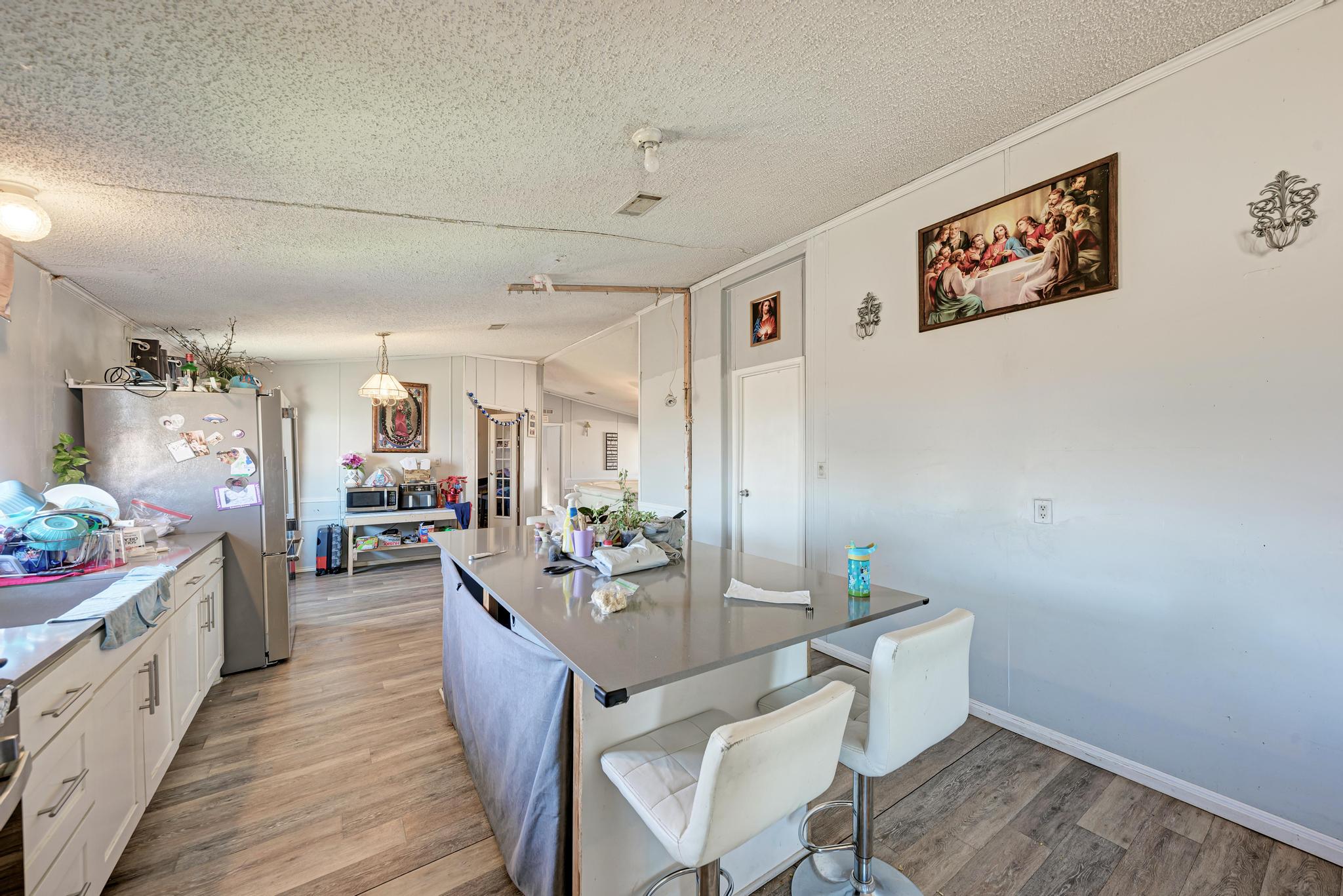 20113 Maynard Court Coupland, TX 78615 - Photo 12 of 37 a view of a dining room with furniture and wooden floor