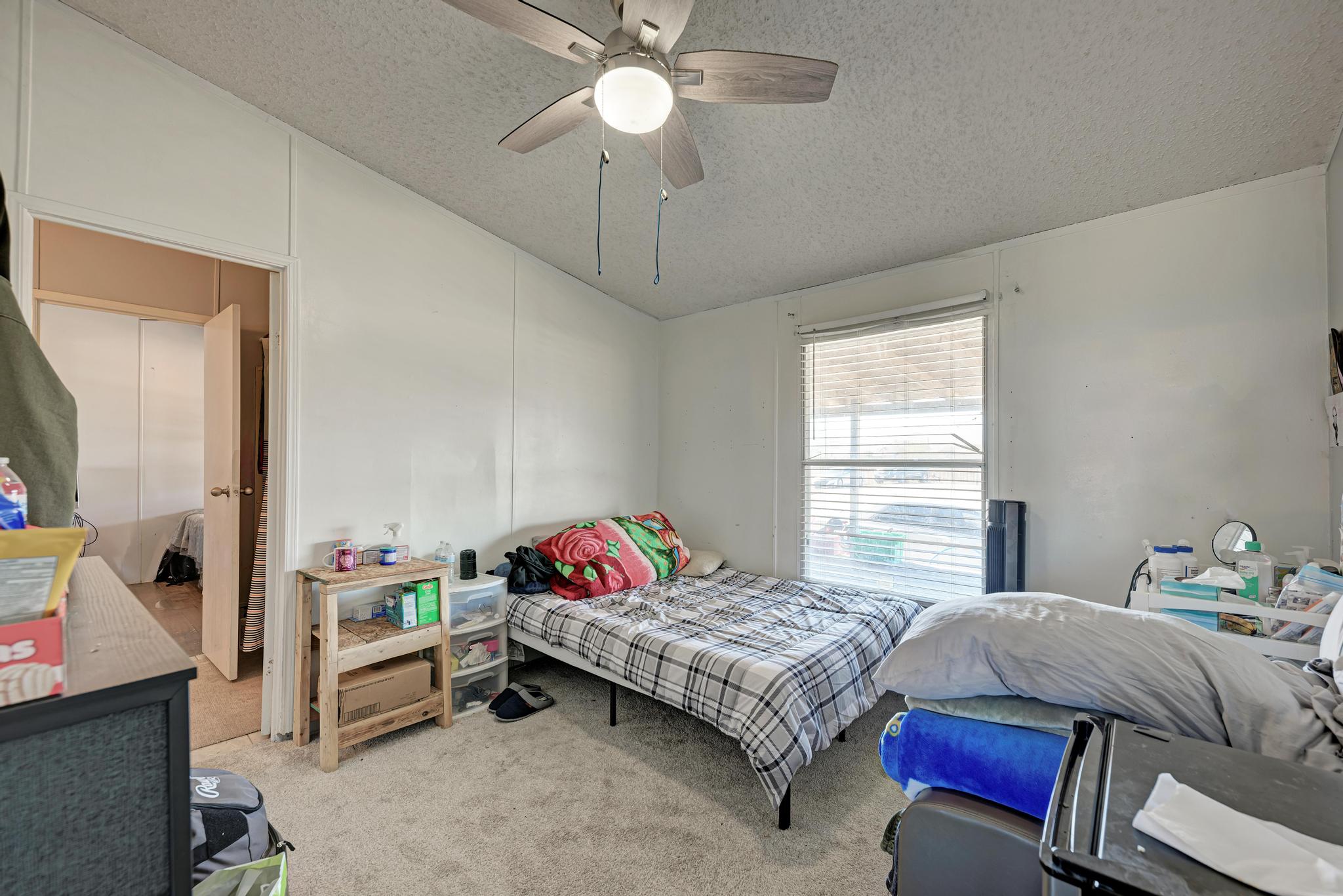 20113 Maynard Court Coupland, TX 78615 - Photo 20 of 37 a bedroom with furniture and a window