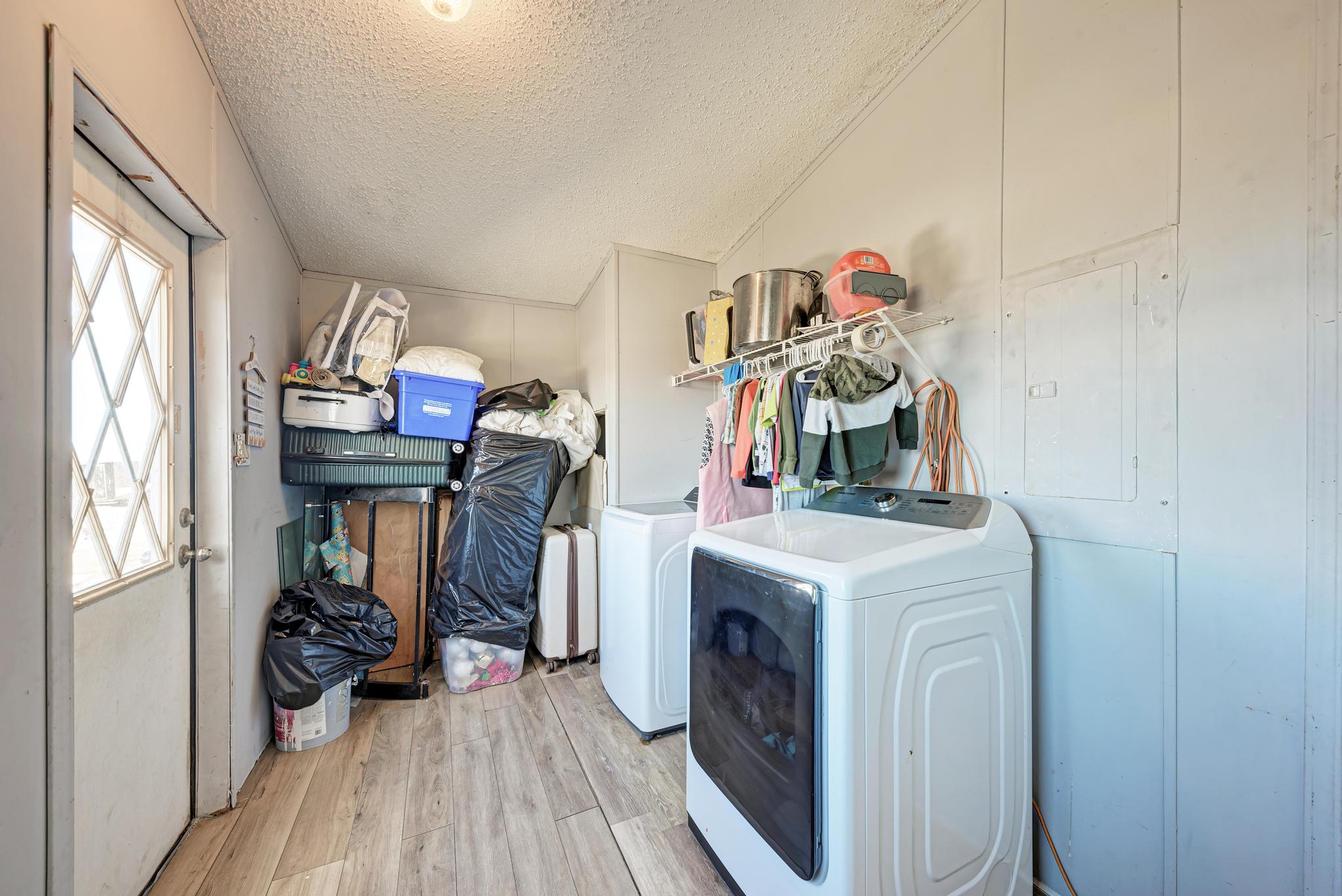 20113 Maynard Court Coupland, TX 78615 - Photo 24 of 37 a view of a storage & utility room with washer and dryer