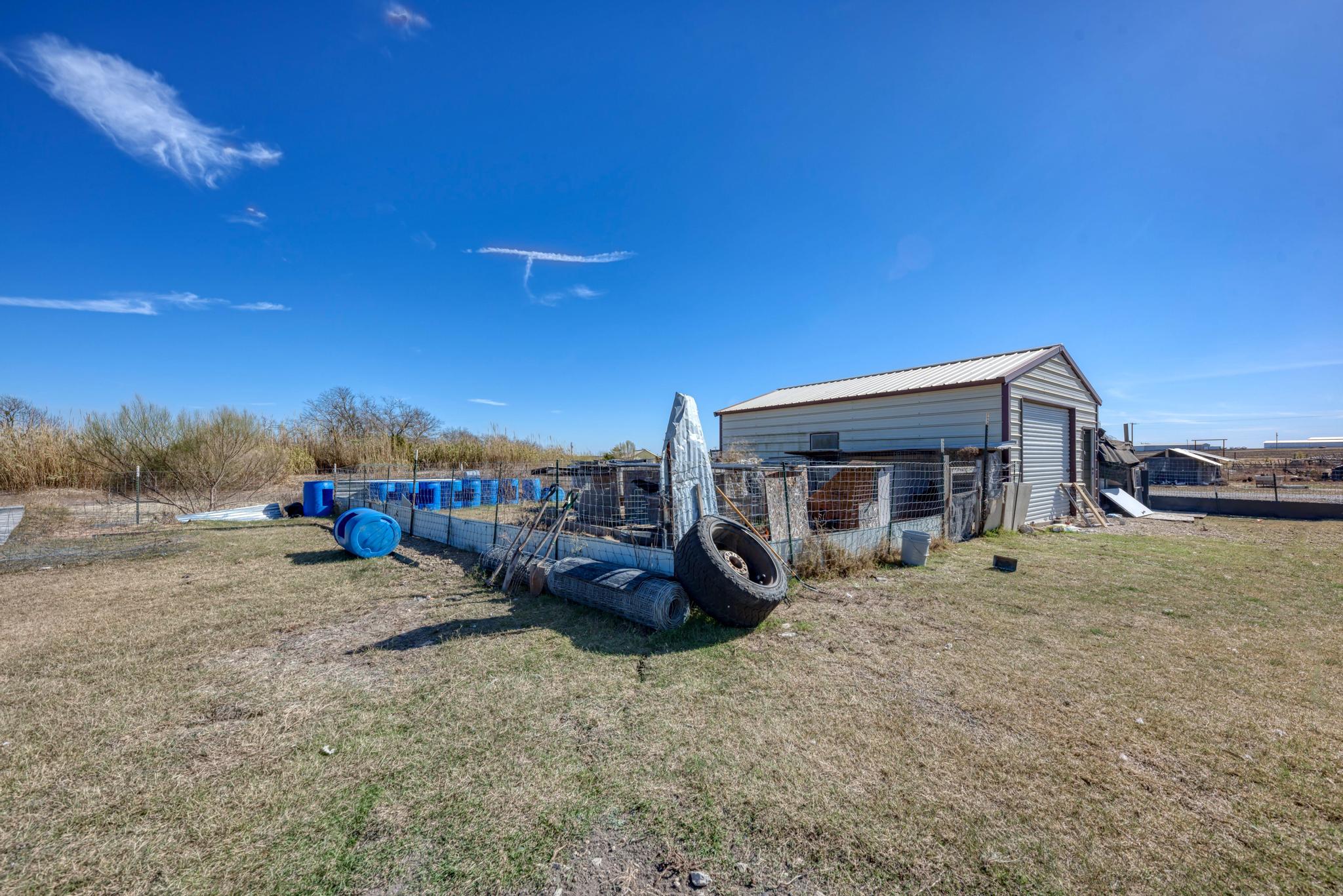 20113 Maynard Court Coupland, TX 78615 - Photo 28 of 37 a view of a house with a yard