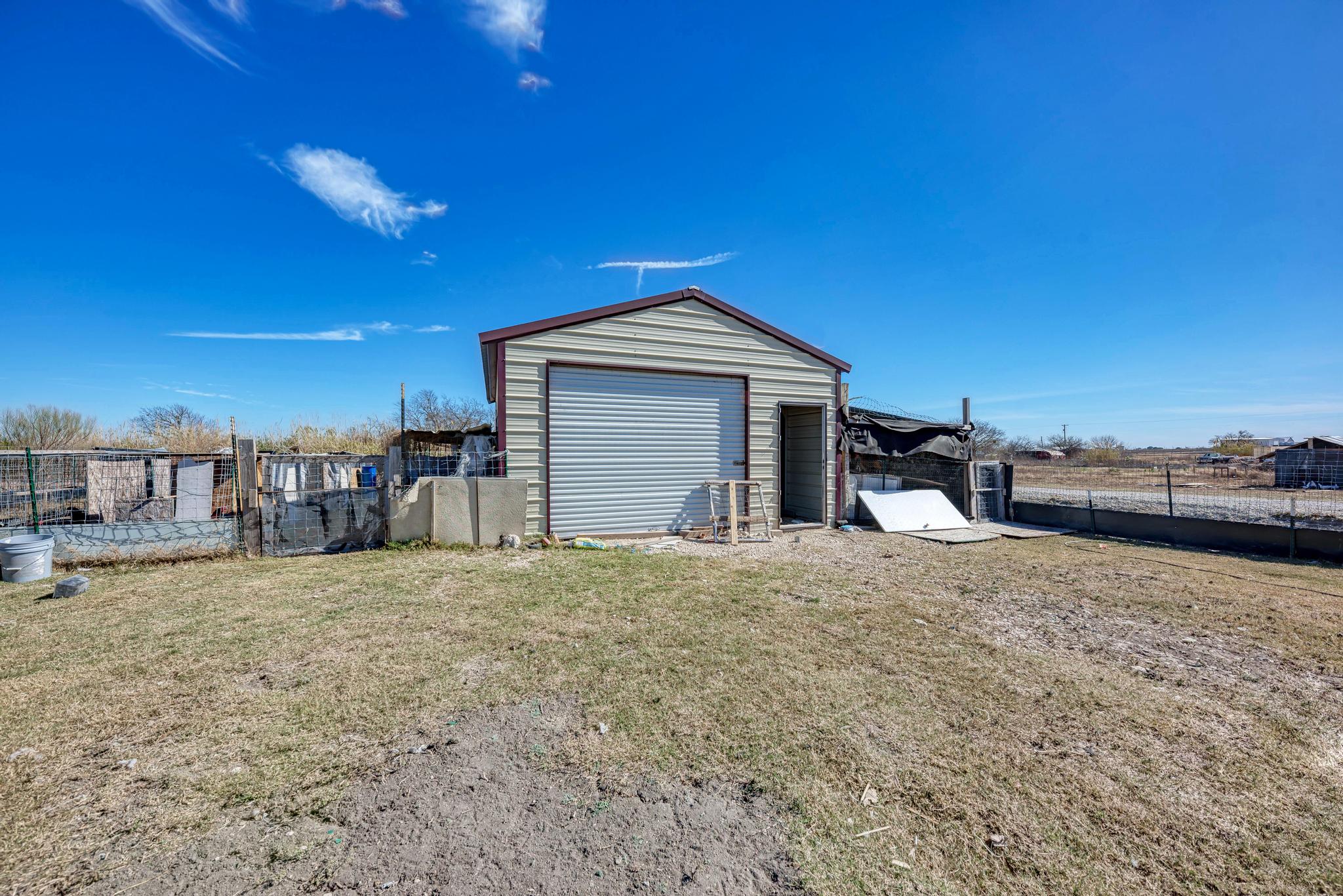 20113 Maynard Court Coupland, TX 78615 - Photo 29 of 37 a front view of a house with a yard