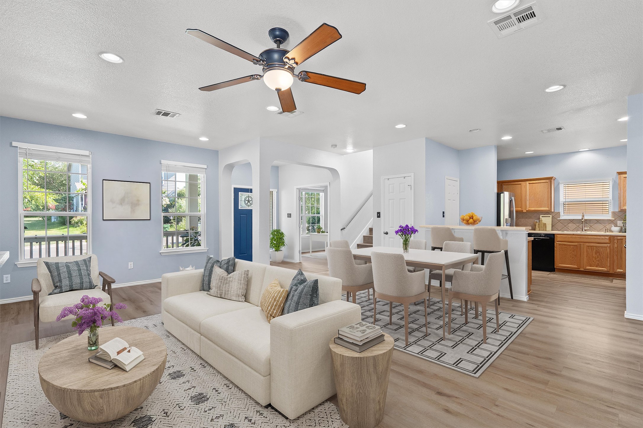 1833 Thompson Trail Round Rock, TX 78664 - Photo 3 of 40 Natural light bathes this open-concept living space, offering seamless transitions between living, dining, and kitchen areas.