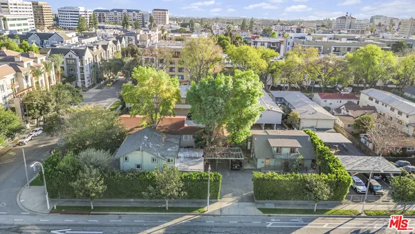 an aerial view of residential houses with outdoor space