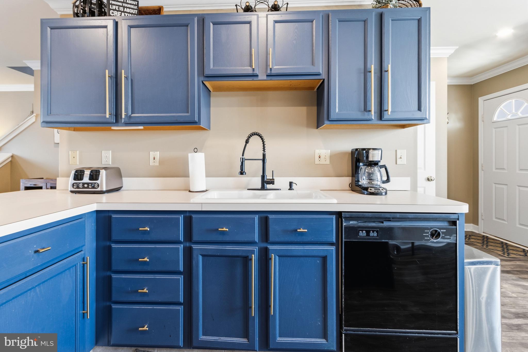 37896 Marina Road, Unit 4 Ocean View, DE 19970 - Photo 14 of 78 a kitchen with stainless steel appliances granite countertop a sink dishwasher and cabinets with wooden floor