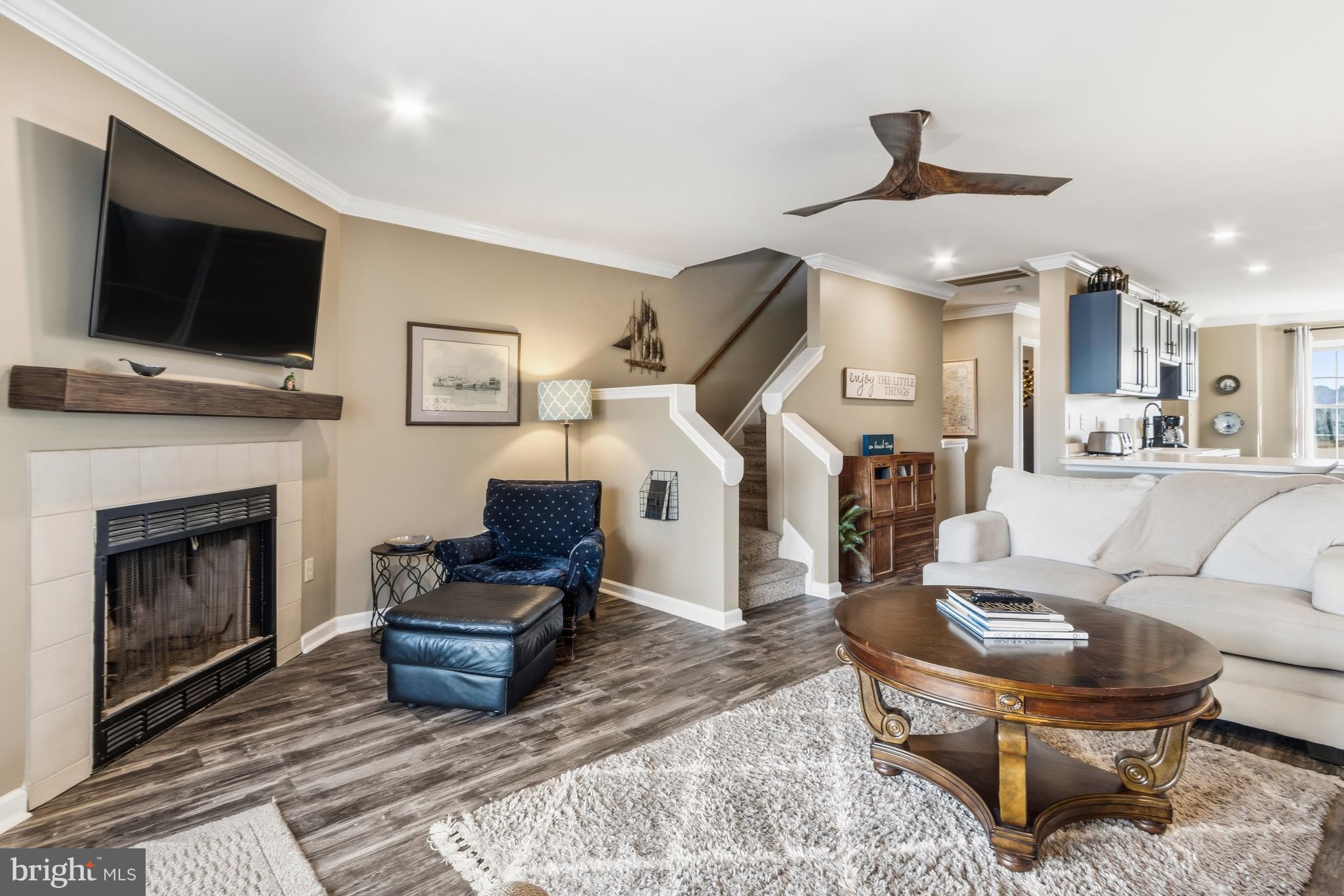 37896 Marina Road, Unit 4 Ocean View, DE 19970 - Photo 23 of 78 a living room with furniture a flat screen tv and a fireplace