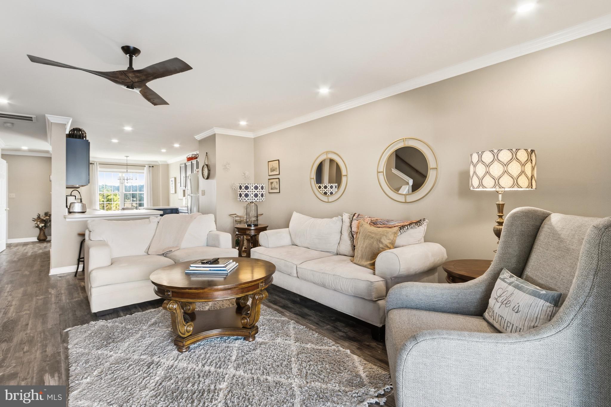 37896 Marina Road, Unit 4 Ocean View, DE 19970 - Photo 24 of 78 a living room with furniture and a clock