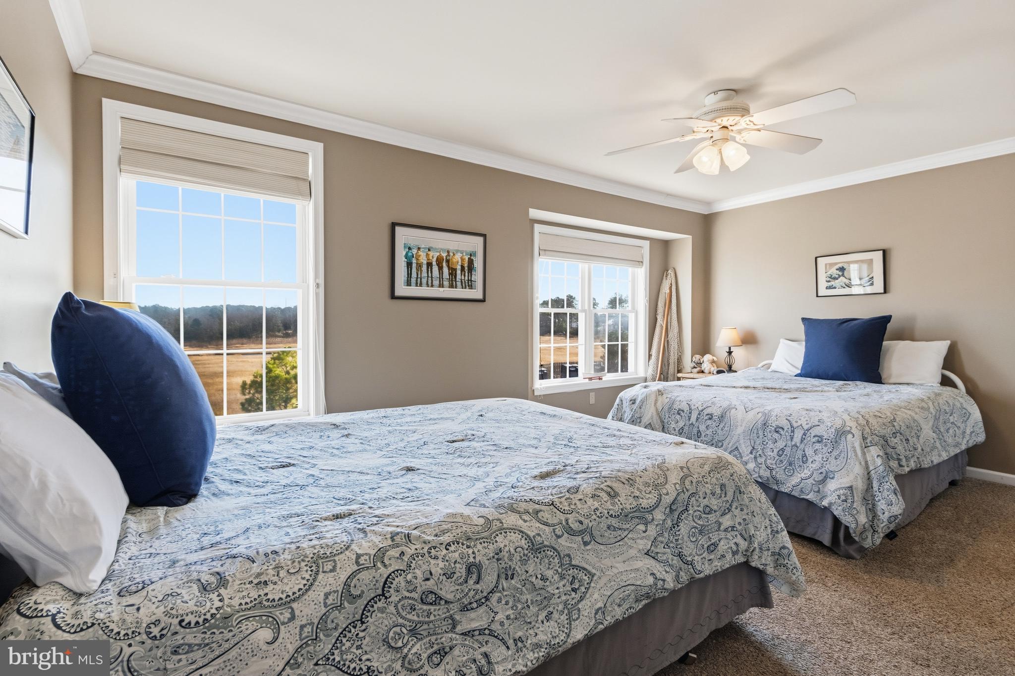 37896 Marina Road, Unit 4 Ocean View, DE 19970 - Photo 31 of 78 a bedroom with a large bed and a window