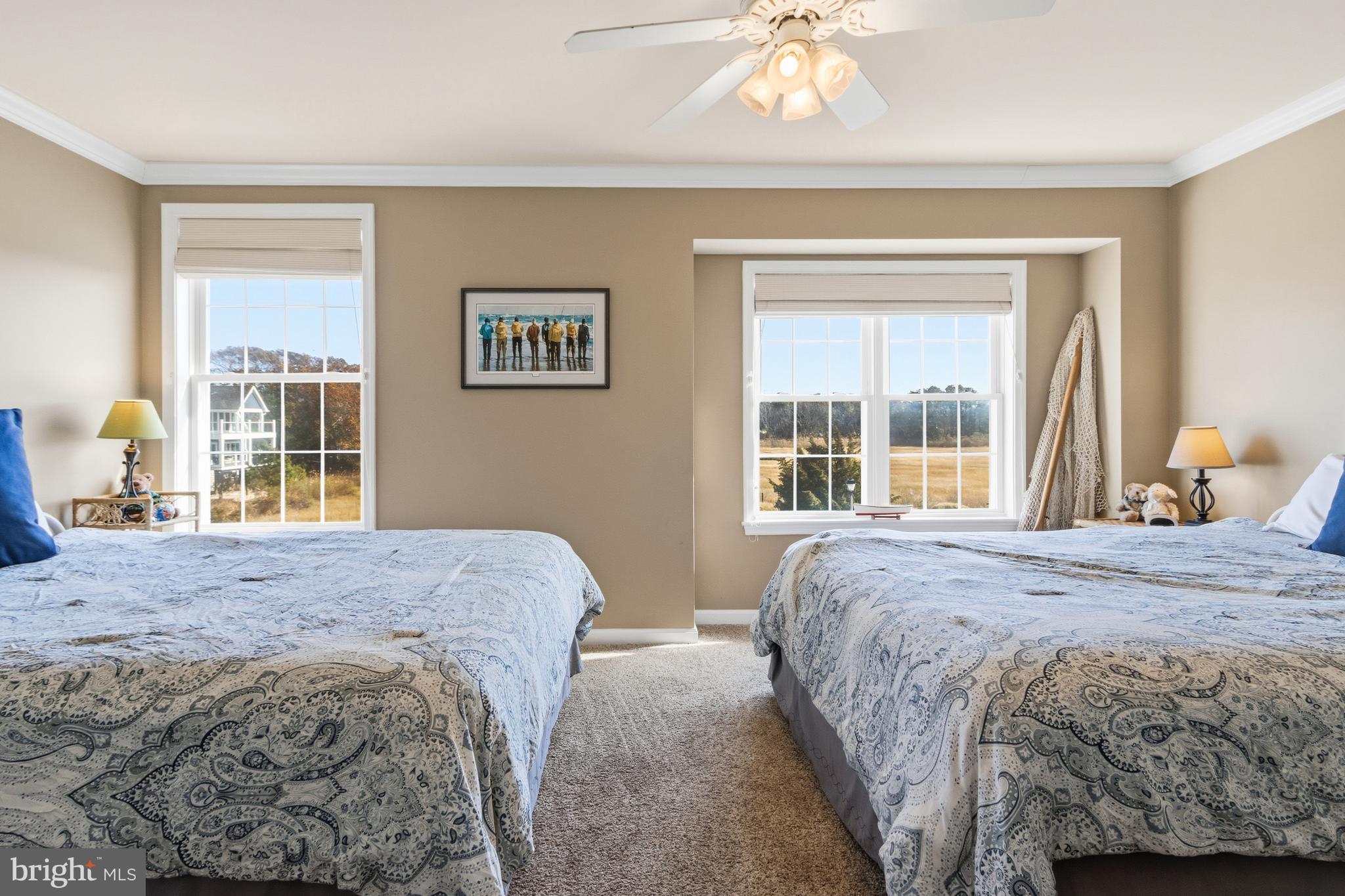 37896 Marina Road, Unit 4 Ocean View, DE 19970 - Photo 32 of 78 a bedroom with a bed and a window