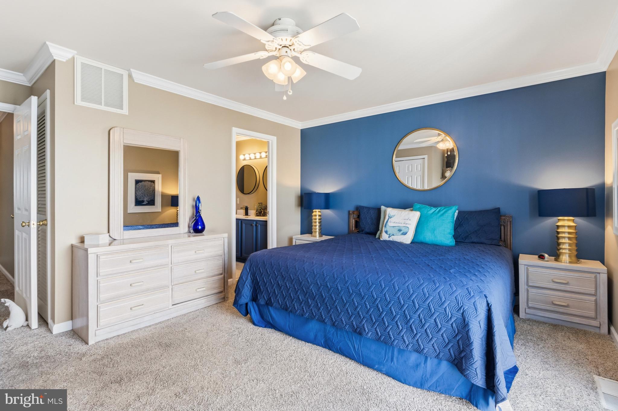 37896 Marina Road, Unit 4 Ocean View, DE 19970 - Photo 38 of 78 a bedroom with a bed and a chandelier