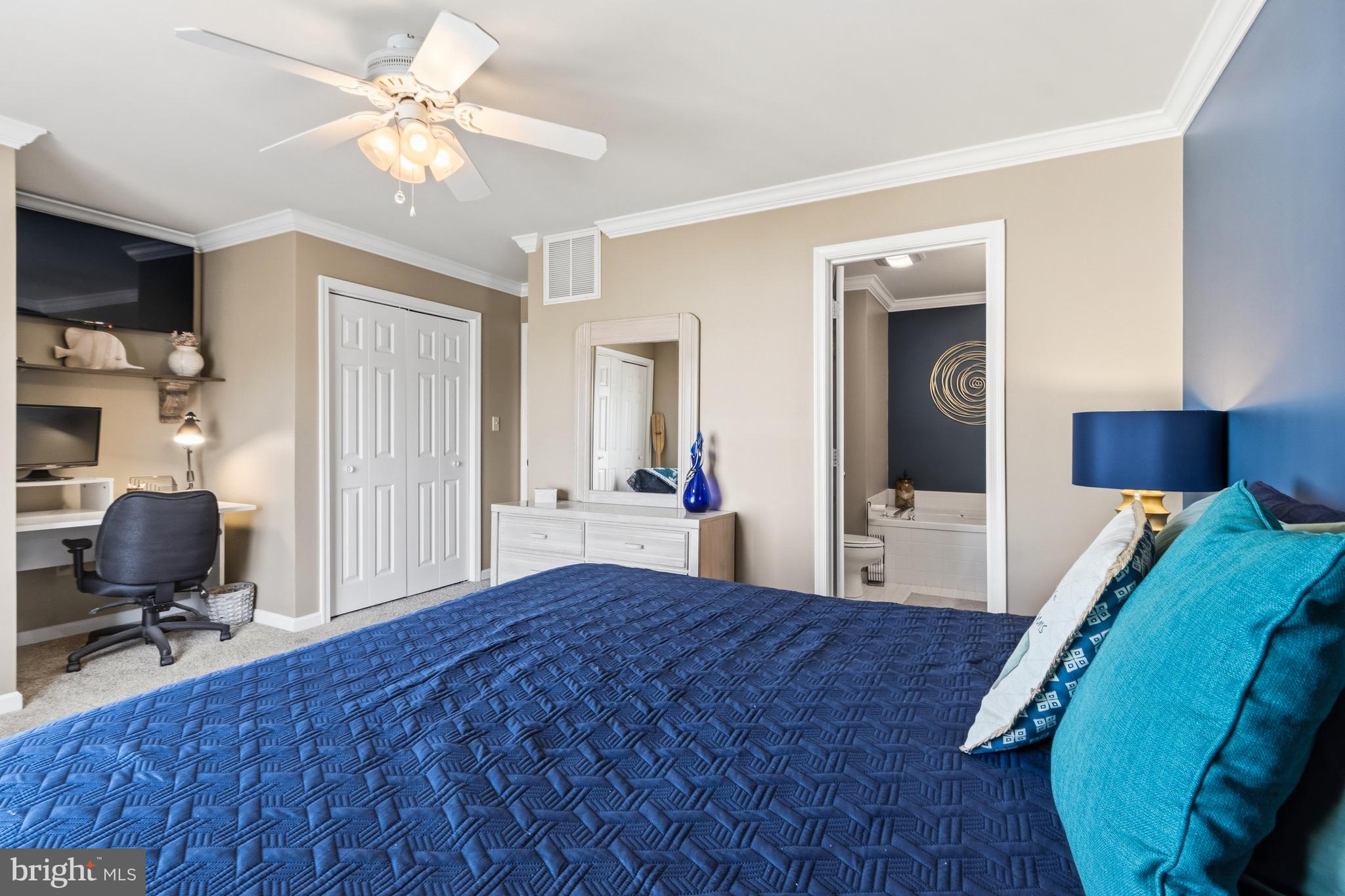 37896 Marina Road, Unit 4 Ocean View, DE 19970 - Photo 39 of 78 a bedroom with a bed window and a chair