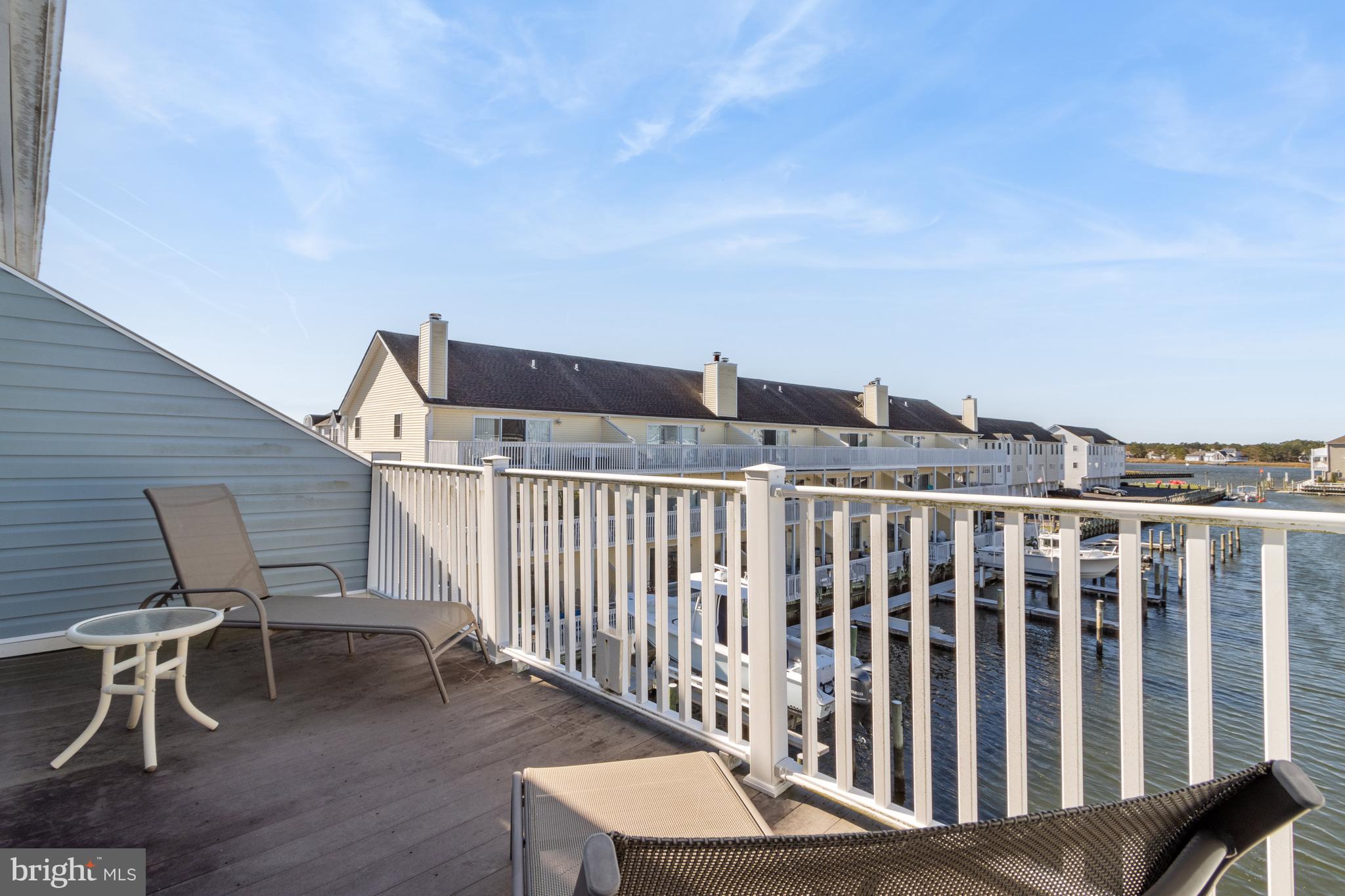 37896 Marina Road, Unit 4 Ocean View, DE 19970 - Photo 40 of 78 a view of a chair and table in the balcony