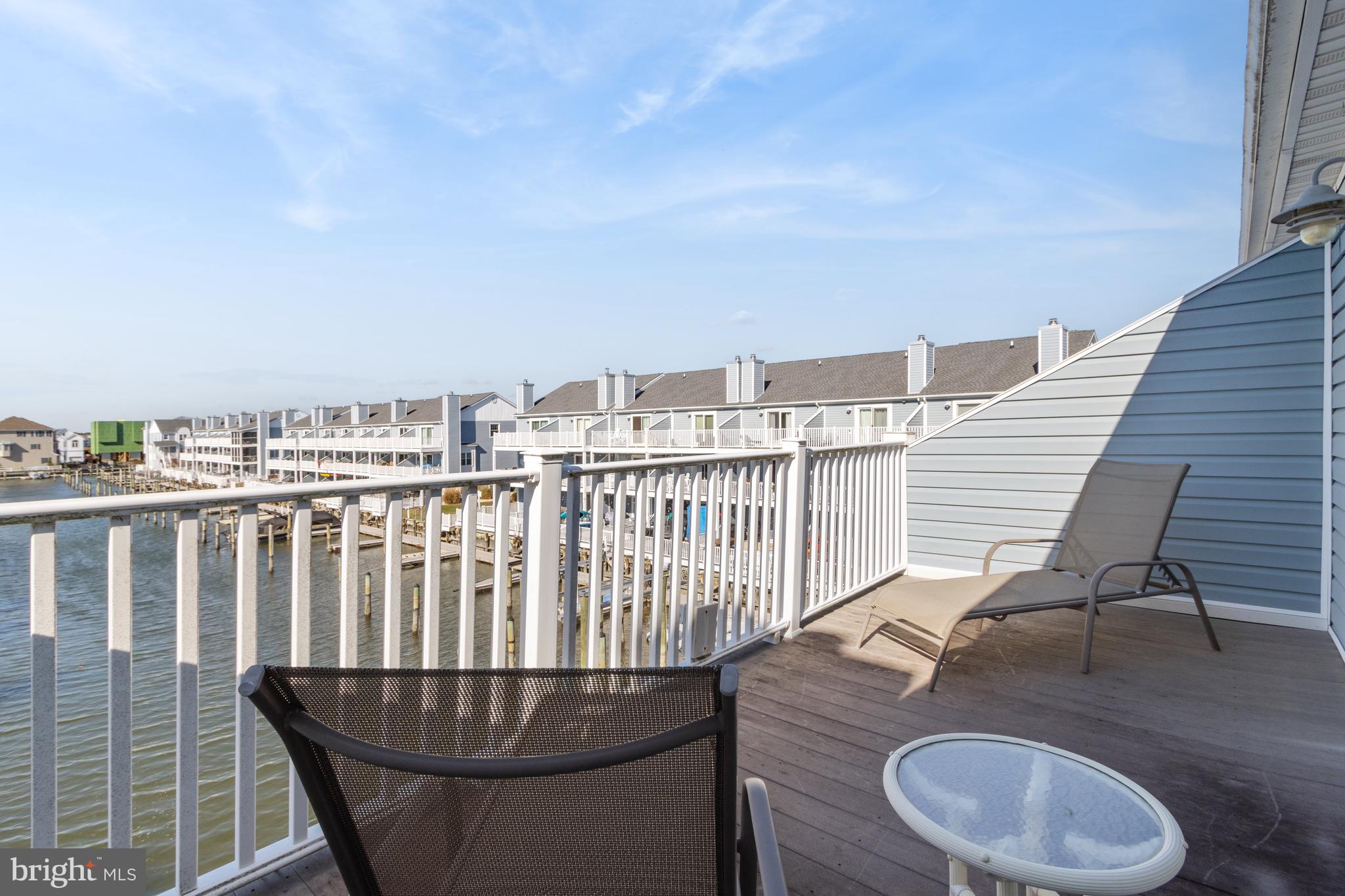 37896 Marina Road, Unit 4 Ocean View, DE 19970 - Photo 41 of 78 a terrace with a table and chairs